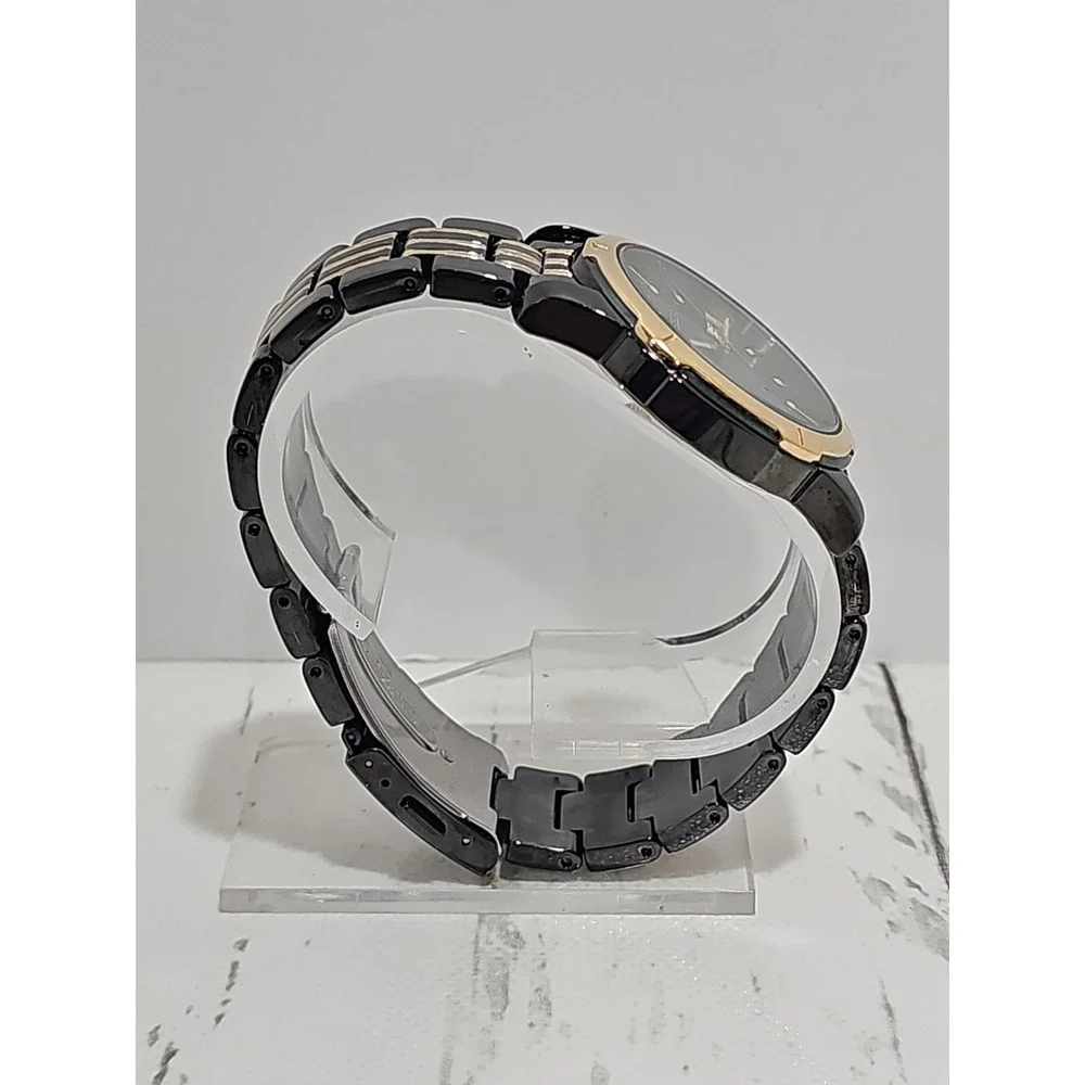 Seiko Quartz 100M watch (black and gold two-tone with day/date)